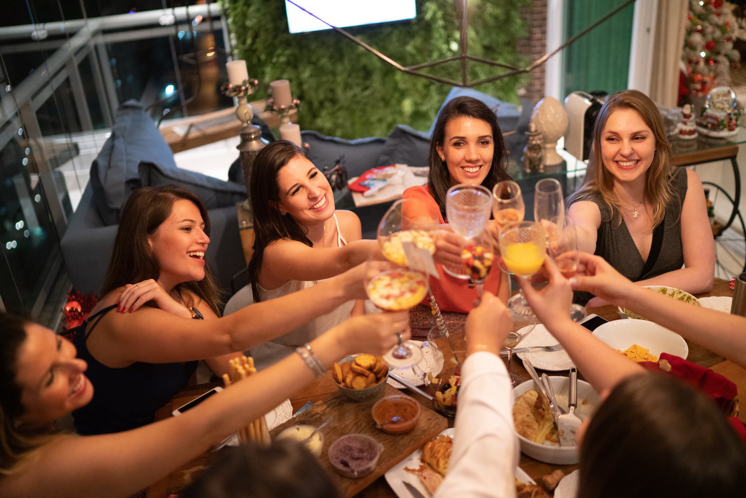 Women get together to enjoy a friendly dinner